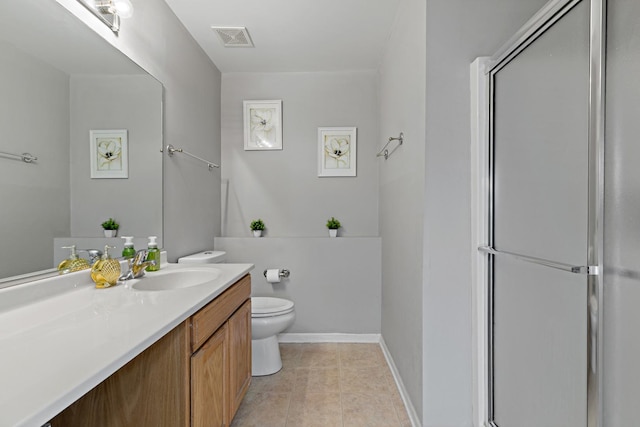 bathroom featuring vanity, toilet, an enclosed shower, and tile patterned flooring