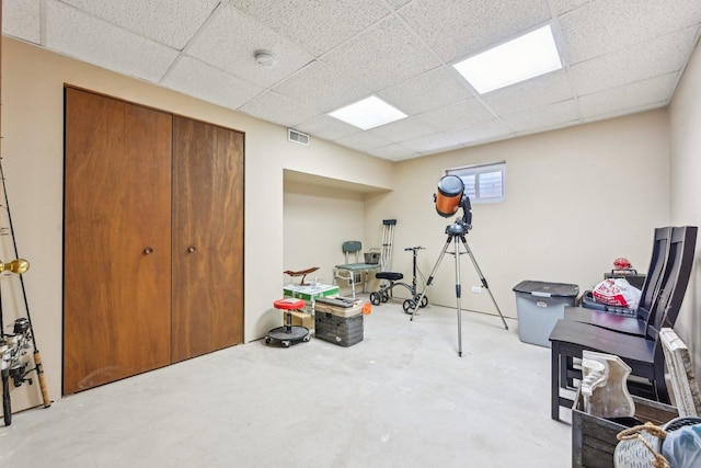 exercise room featuring a drop ceiling and visible vents