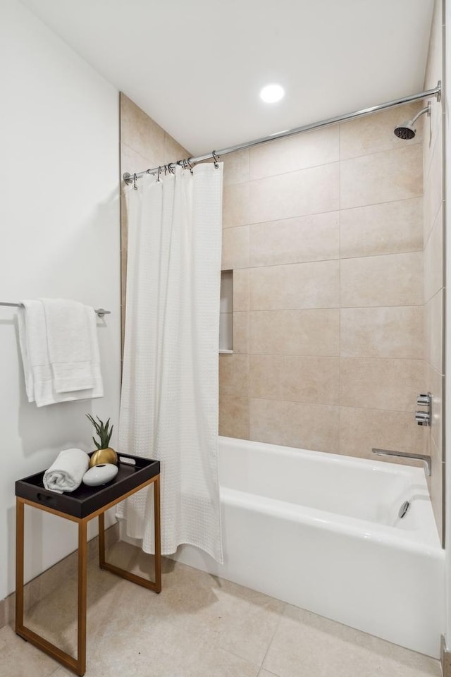 full bathroom with shower / tub combo and tile patterned flooring