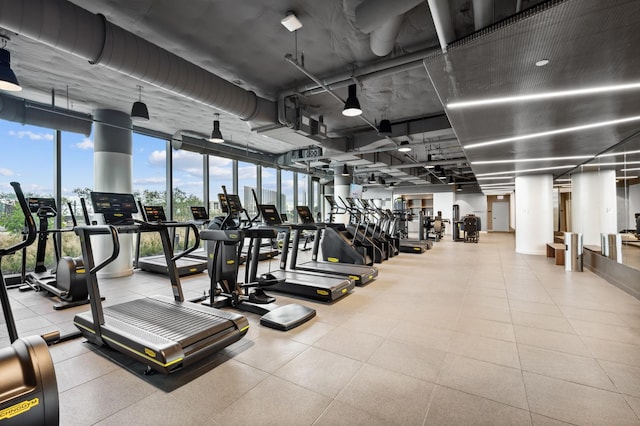 exercise room featuring floor to ceiling windows