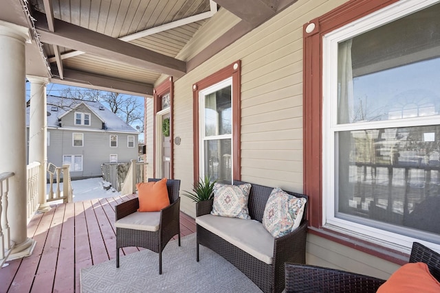 wooden terrace featuring covered porch