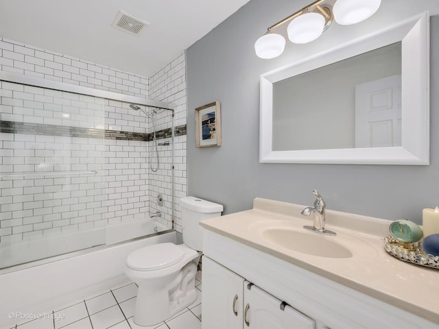 full bath featuring toilet, shower / bath combination with glass door, vanity, visible vents, and tile patterned floors