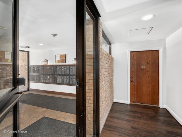 hall featuring mail area, baseboards, wood finished floors, and recessed lighting