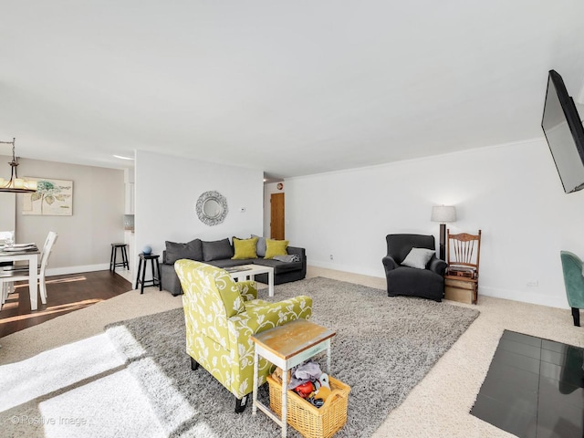 carpeted living room with baseboards