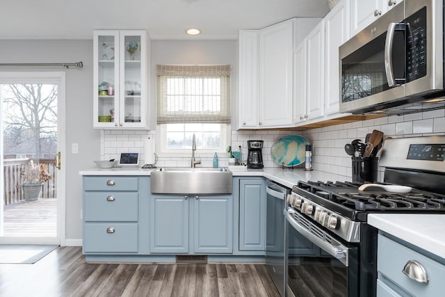 kitchen with white cabinetry, sink, a healthy amount of sunlight, and appliances with stainless steel finishes