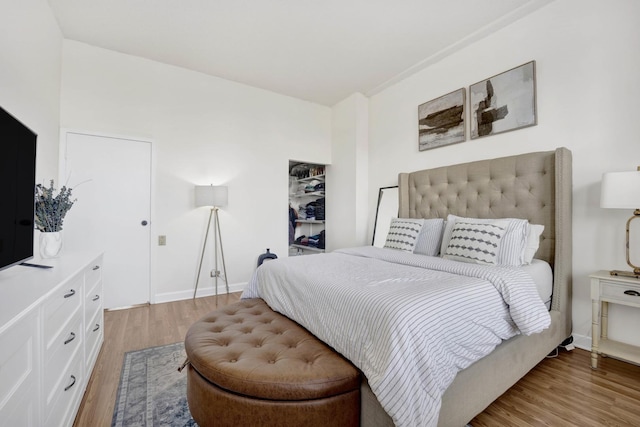 bedroom with light hardwood / wood-style flooring