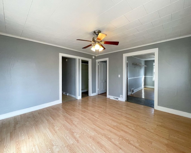 unfurnished bedroom with crown molding, light hardwood / wood-style flooring, and ceiling fan