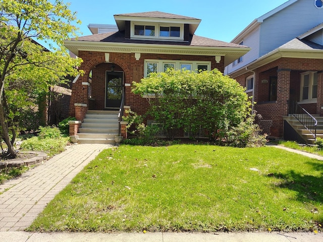 936 N Ridgeland Ave, Oak Park, IL 60302 - view of front of property with a porch, a front lawn, brick siding, and a shingled roof