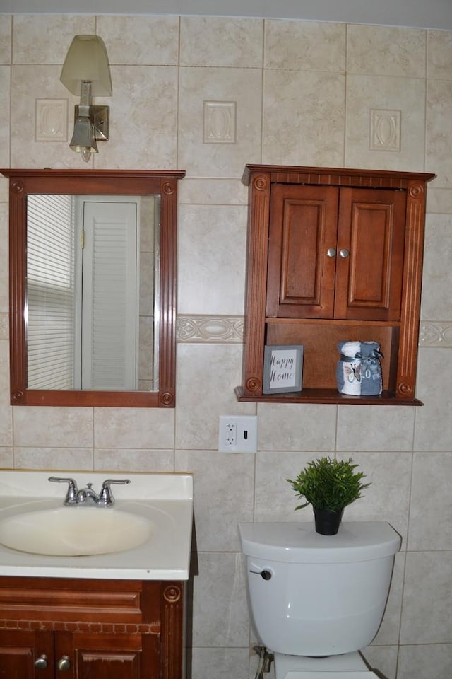 936 N Ridgeland Ave, Oak Park, IL 60302 - half bathroom with tile walls, vanity, and toilet