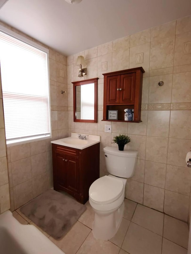 936 N Ridgeland Ave, Oak Park, IL 60302 - bathroom featuring tile walls, toilet, vanity, and tile patterned floors