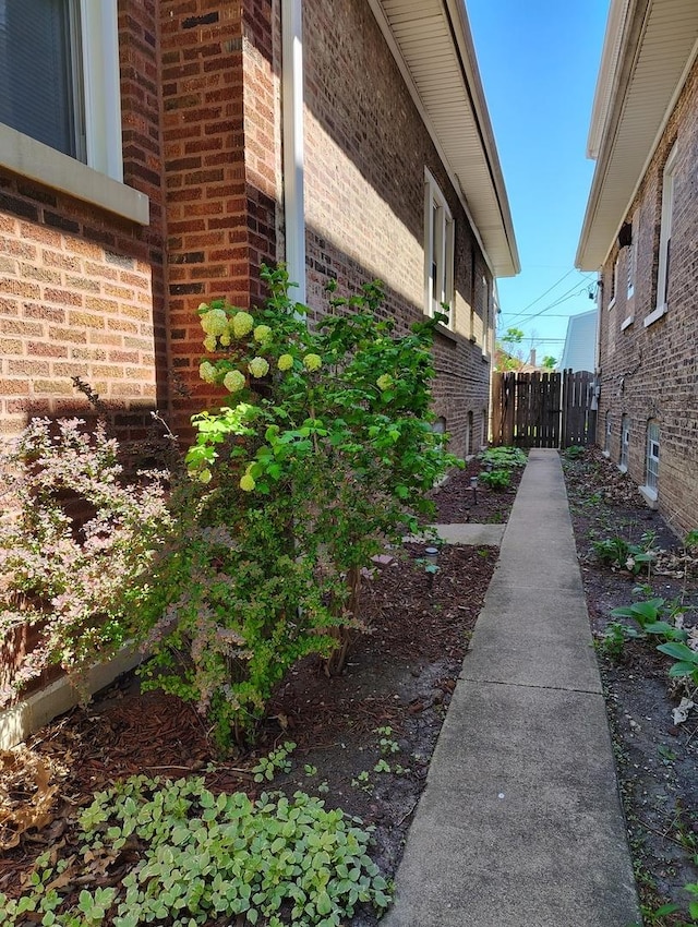 936 N Ridgeland Ave, Oak Park, IL 60302 - view of property exterior featuring brick siding and fence