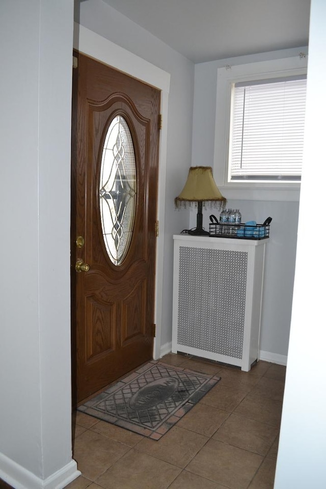 936 N Ridgeland Ave, Oak Park, IL 60302 - foyer with baseboards, tile patterned flooring, and radiator