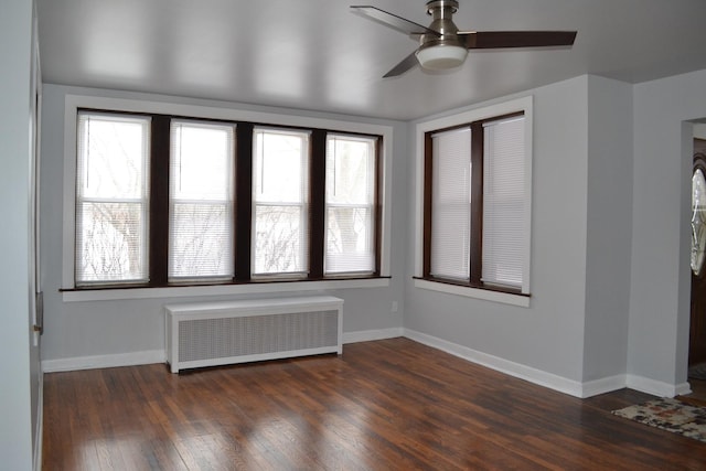 936 N Ridgeland Ave, Oak Park, IL 60302 - spare room with radiator, ceiling fan, wood finished floors, and baseboards