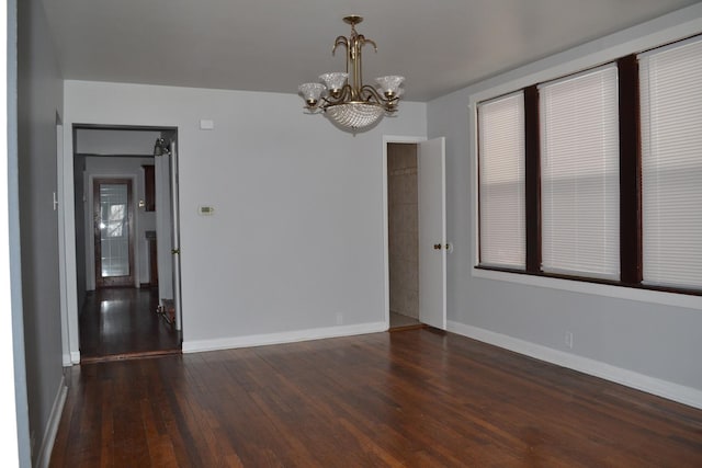 936 N Ridgeland Ave, Oak Park, IL 60302 - empty room with a chandelier, wood finished floors, and baseboards