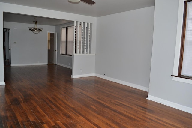 936 N Ridgeland Ave, Oak Park, IL 60302 - unfurnished room featuring a chandelier, wood finished floors, baseboards, and ceiling fan
