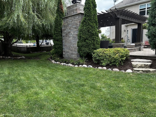 view of yard featuring entry steps, fence, and a pergola