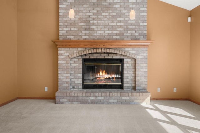 interior details with carpet, a fireplace, and baseboards