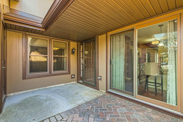 property entrance featuring a patio area