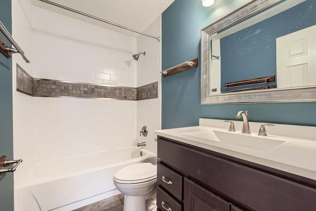 full bathroom featuring tiled shower / bath combo, vanity, and toilet