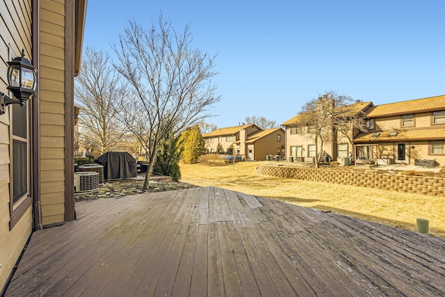 wooden deck featuring central AC unit