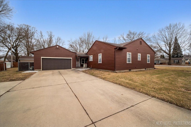 view of front of home featuring a garage and a front lawn