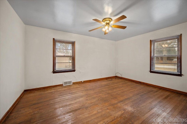 unfurnished room featuring hardwood / wood-style floors and ceiling fan