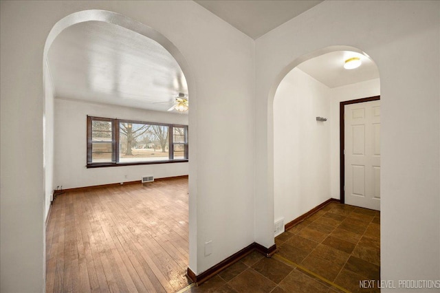 corridor featuring dark hardwood / wood-style floors