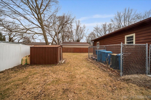 view of yard with central air condition unit and a shed