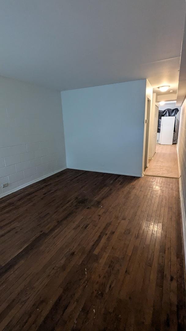 spare room featuring dark hardwood / wood-style flooring