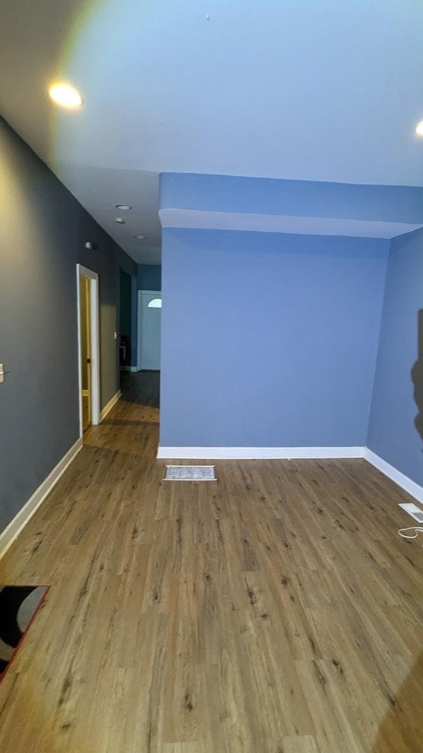 empty room with wood-type flooring