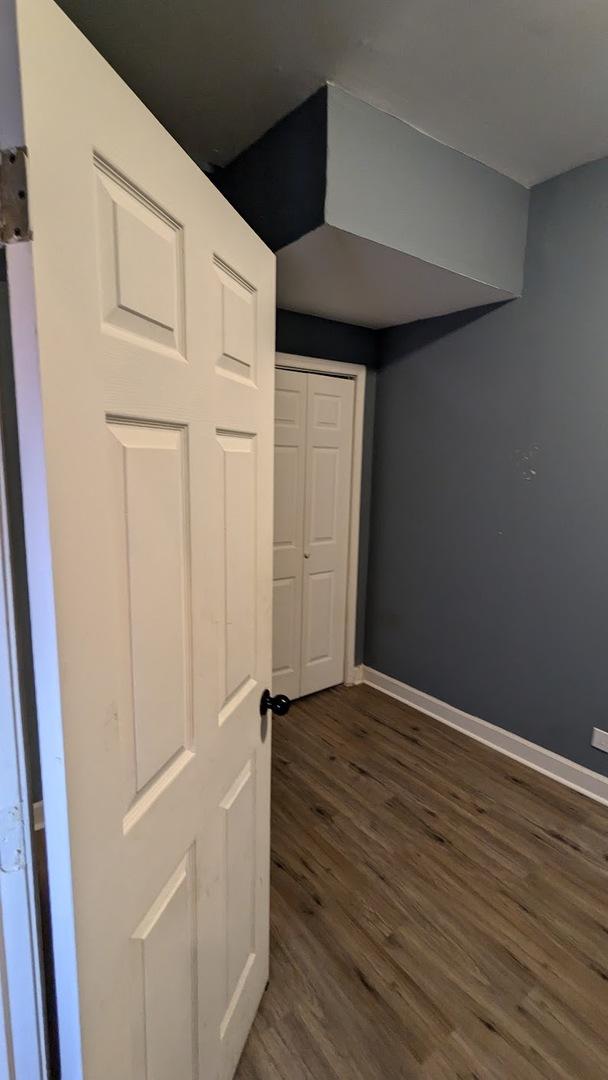basement featuring dark wood-type flooring