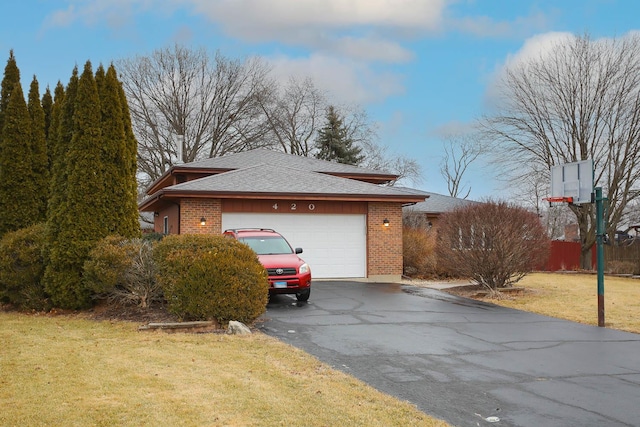 view of home's exterior with a garage and a yard