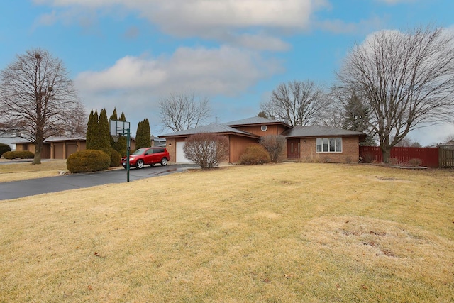 view of front of house with a garage and a front yard