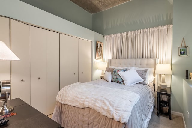 carpeted bedroom featuring a closet