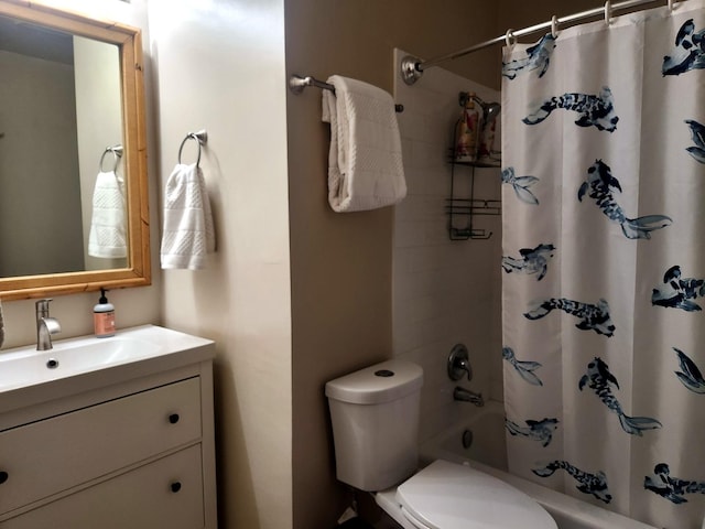 full bathroom with vanity, shower / bath combination with curtain, and toilet