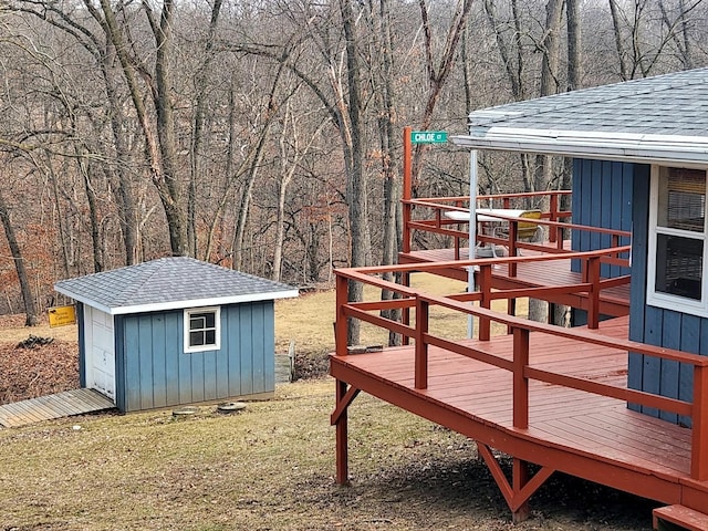 view of yard with a deck and a shed