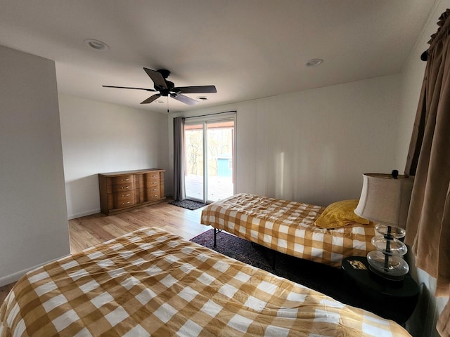 bedroom with access to exterior, ceiling fan, and light hardwood / wood-style flooring