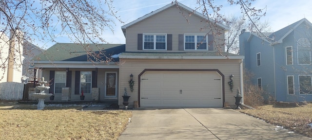 view of front property featuring a front lawn and a garage