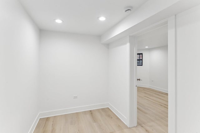 interior space featuring light wood finished floors, baseboards, and recessed lighting