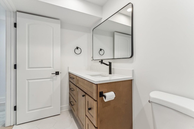 bathroom featuring toilet and vanity