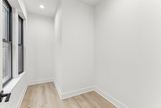 interior space featuring light wood finished floors, baseboards, and recessed lighting