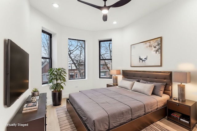 bedroom featuring ceiling fan, baseboards, and recessed lighting