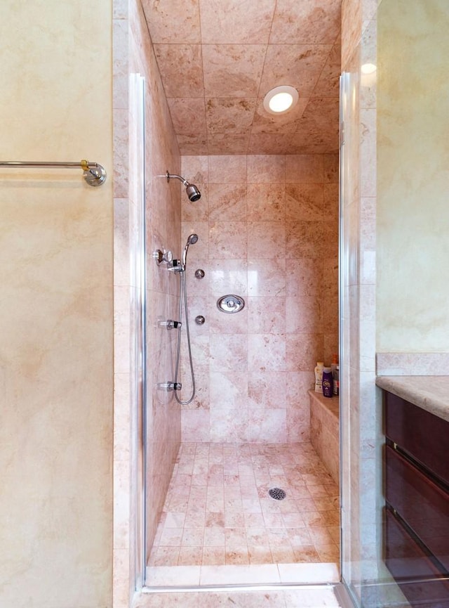 full bath featuring a shower stall and vanity