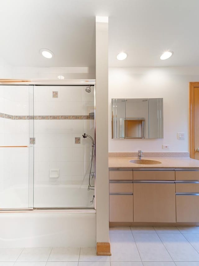 bathroom featuring recessed lighting, tile patterned flooring, combined bath / shower with glass door, and vanity