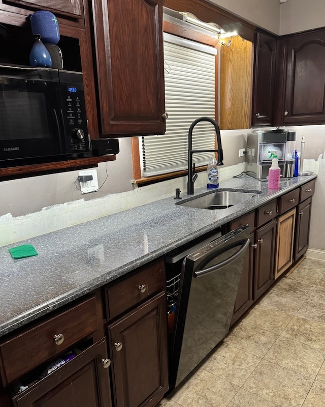 kitchen featuring stone counters, sink, dark brown cabinets, and black appliances