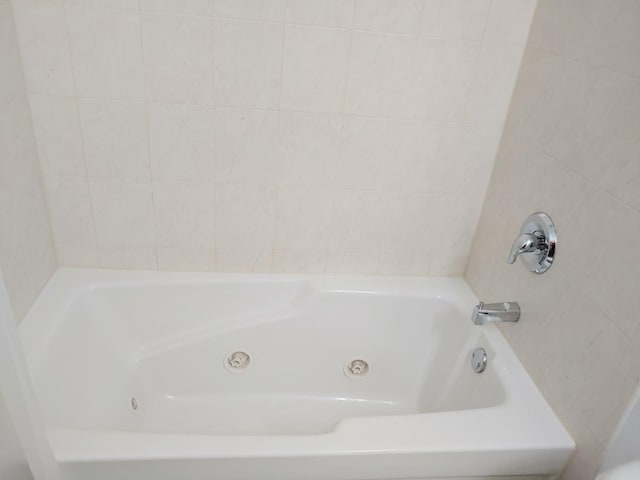 bathroom with a tub to relax in