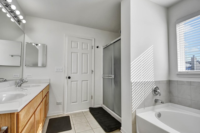 bathroom with tile patterned flooring, vanity, and independent shower and bath