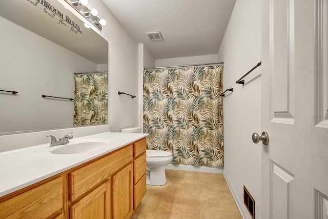 bathroom featuring tile patterned flooring, vanity, a shower with shower curtain, and toilet