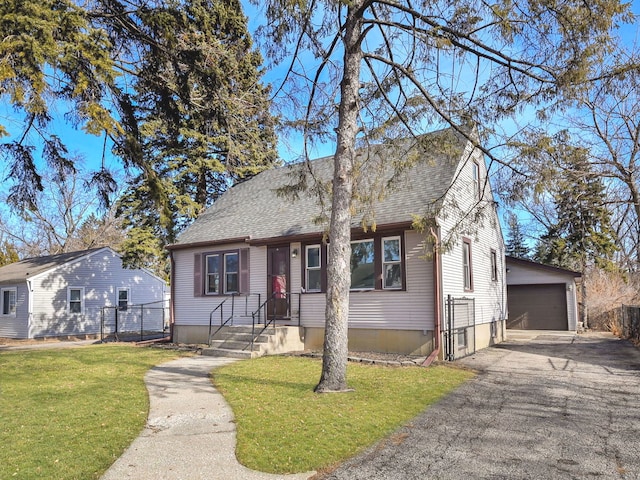 bungalow-style home with a garage and a front yard