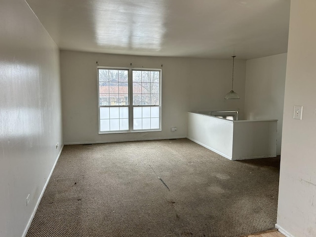 unfurnished living room featuring carpet floors